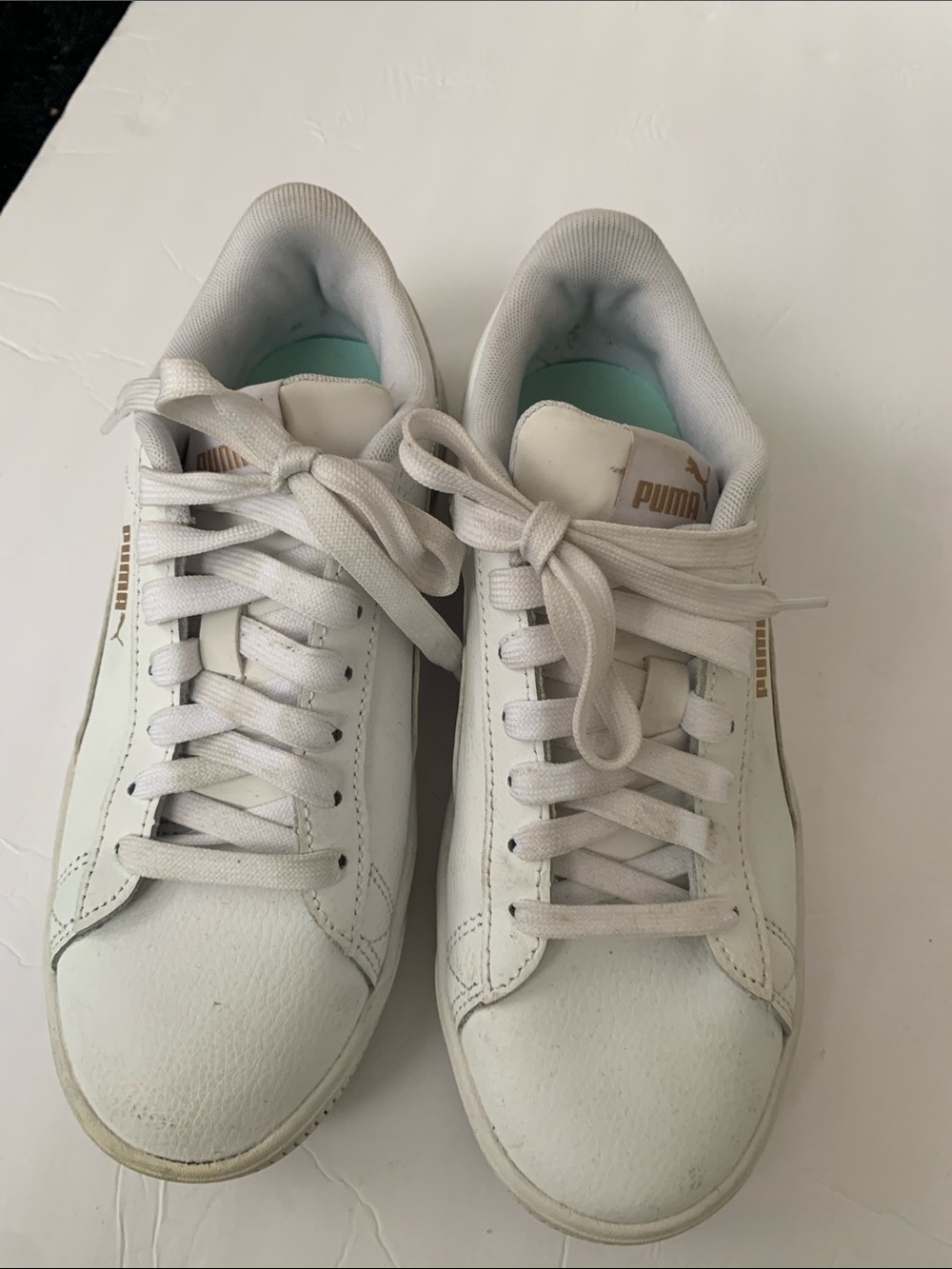 Puma White Leather Low-Top Sneakers with Gold Branding lightly worn